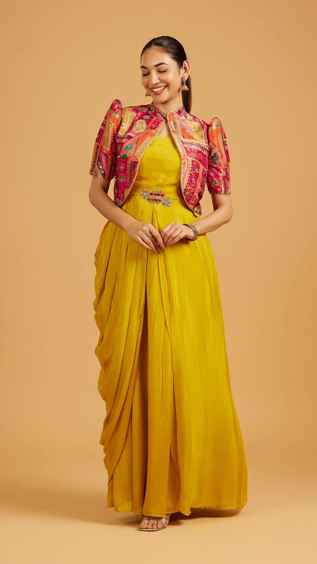 Girl wearing yellow maxi dress styled for Indian wedding celebration